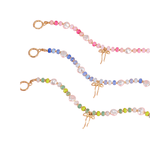 Colorful beaded necklace with gold clasp on a white background
